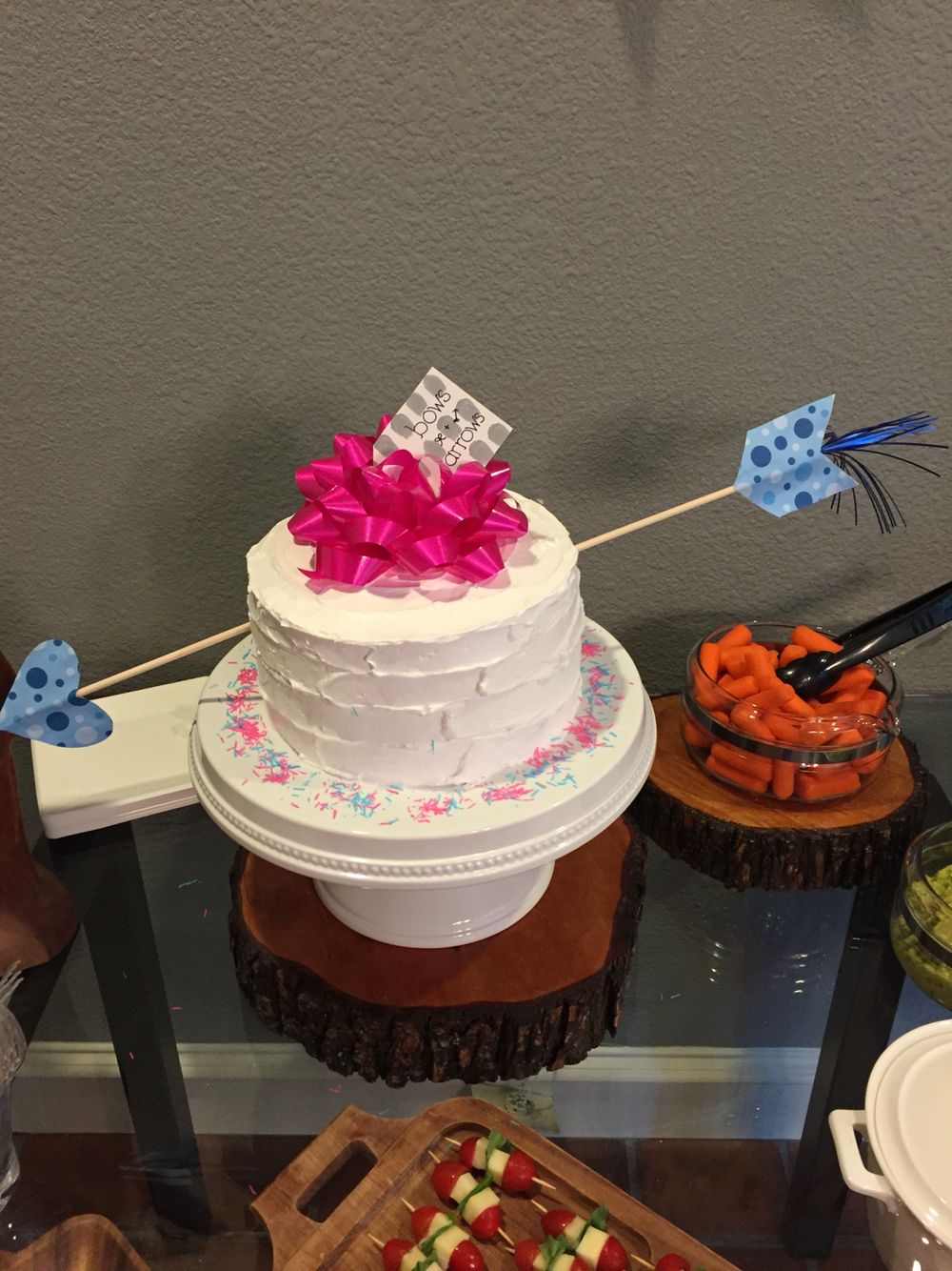 Bow and arrow gender reveal cake