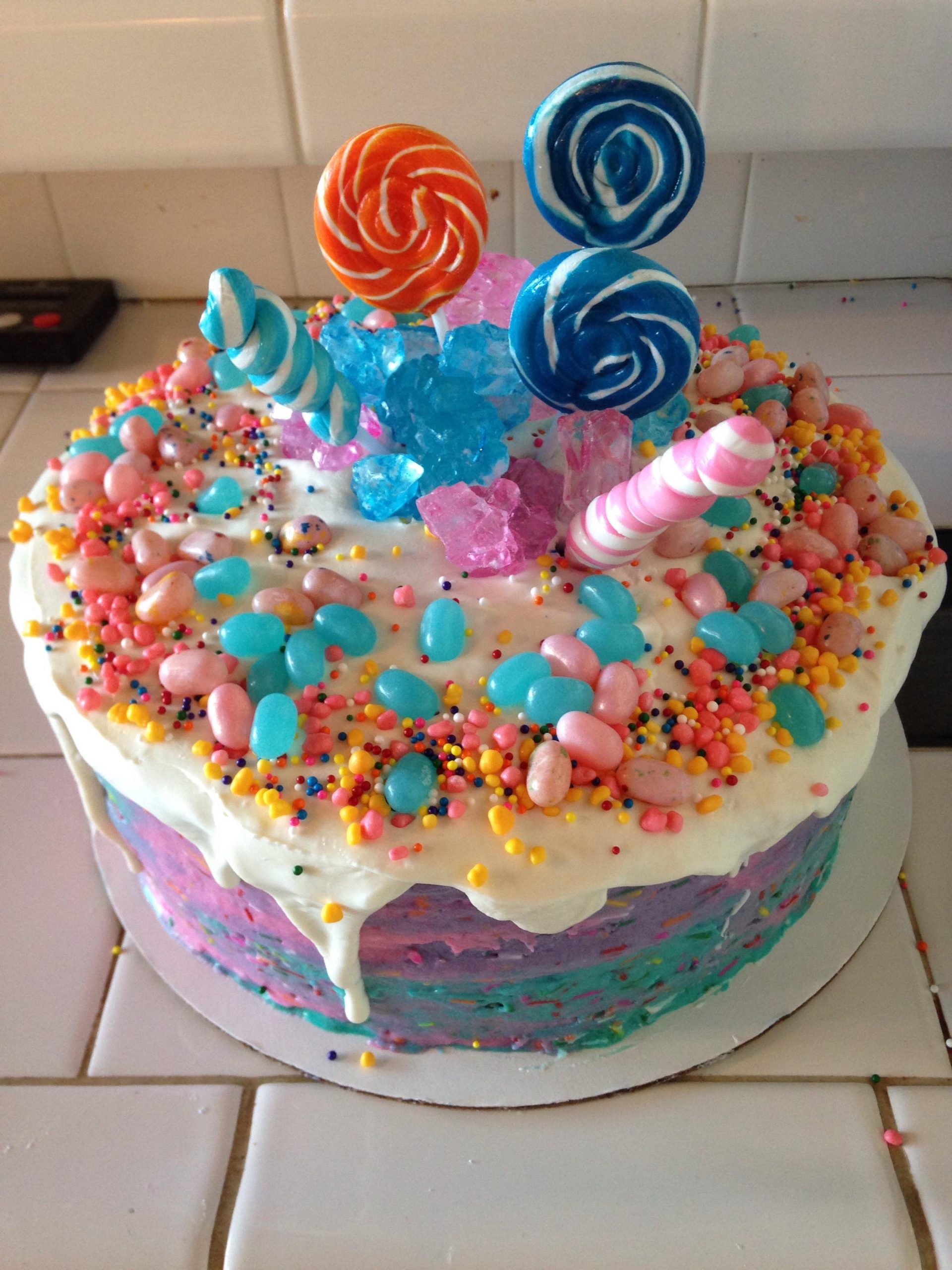 Cotton candy buttercream cake with candy decorations ...