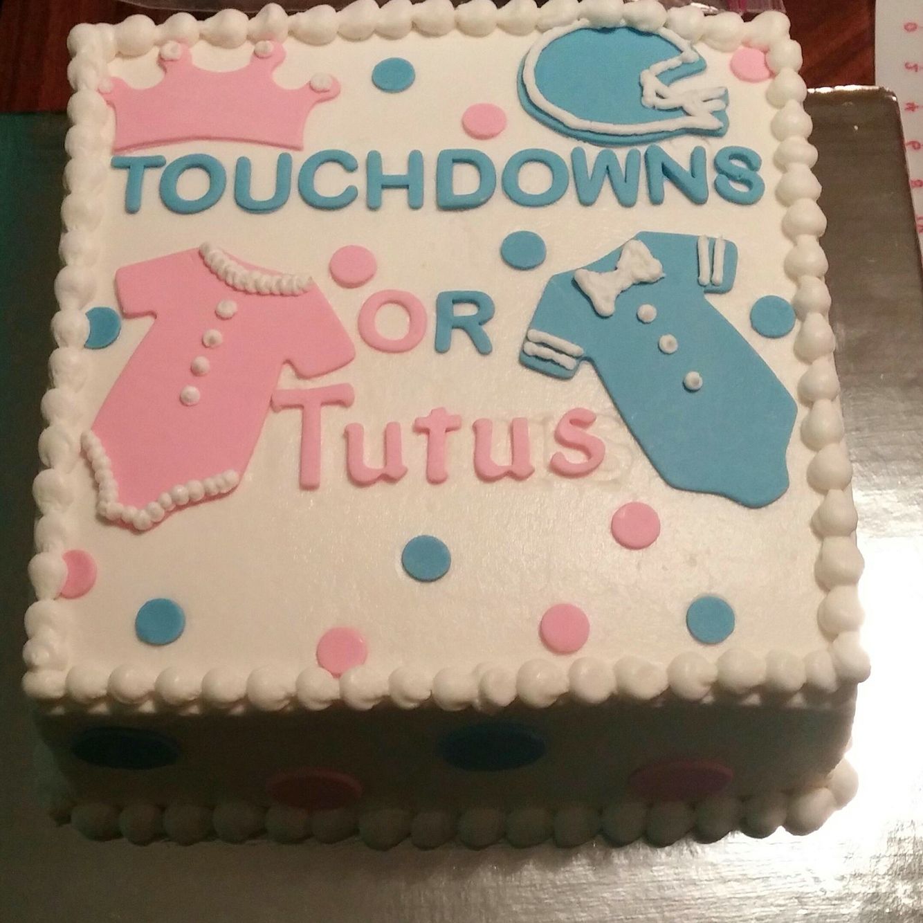 Gender reveal cake Touchdowns or tutus