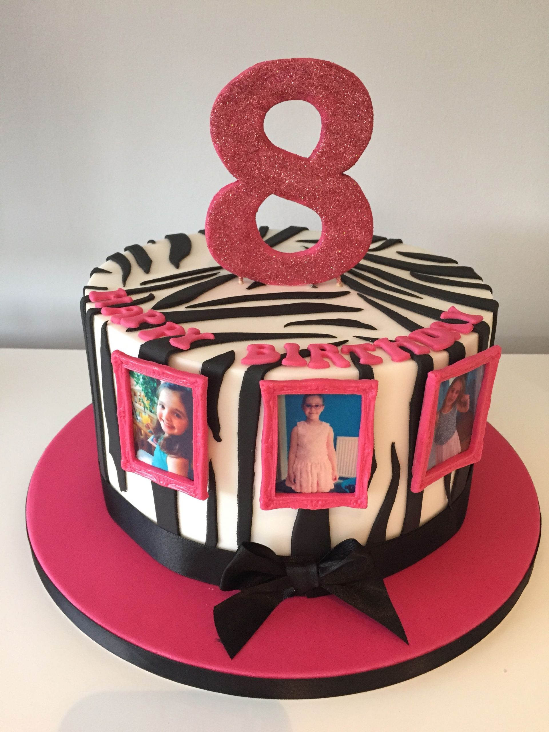 Girly zebra print cake with edible pictures in edible frames.