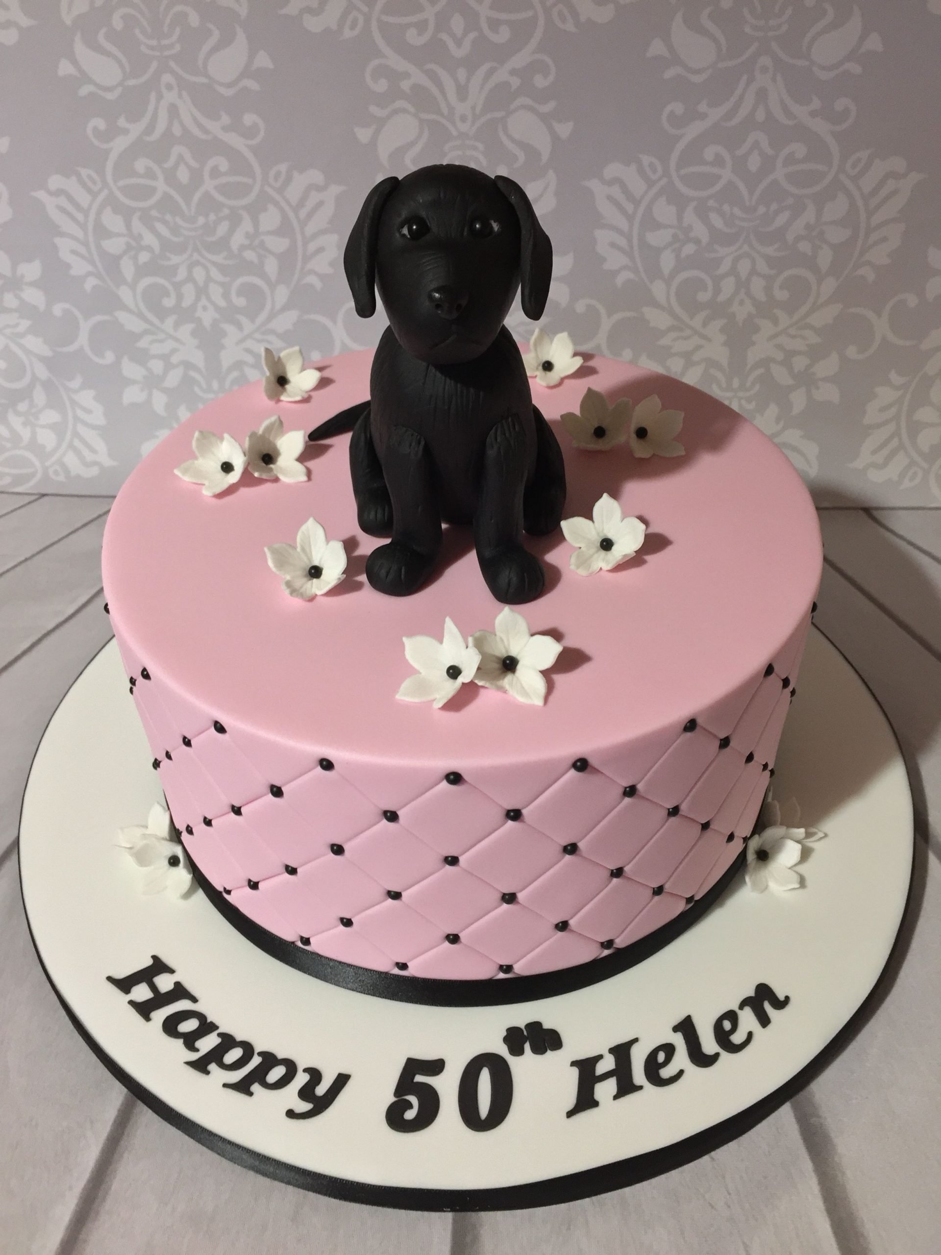 Pink quilted cake with black Labrador