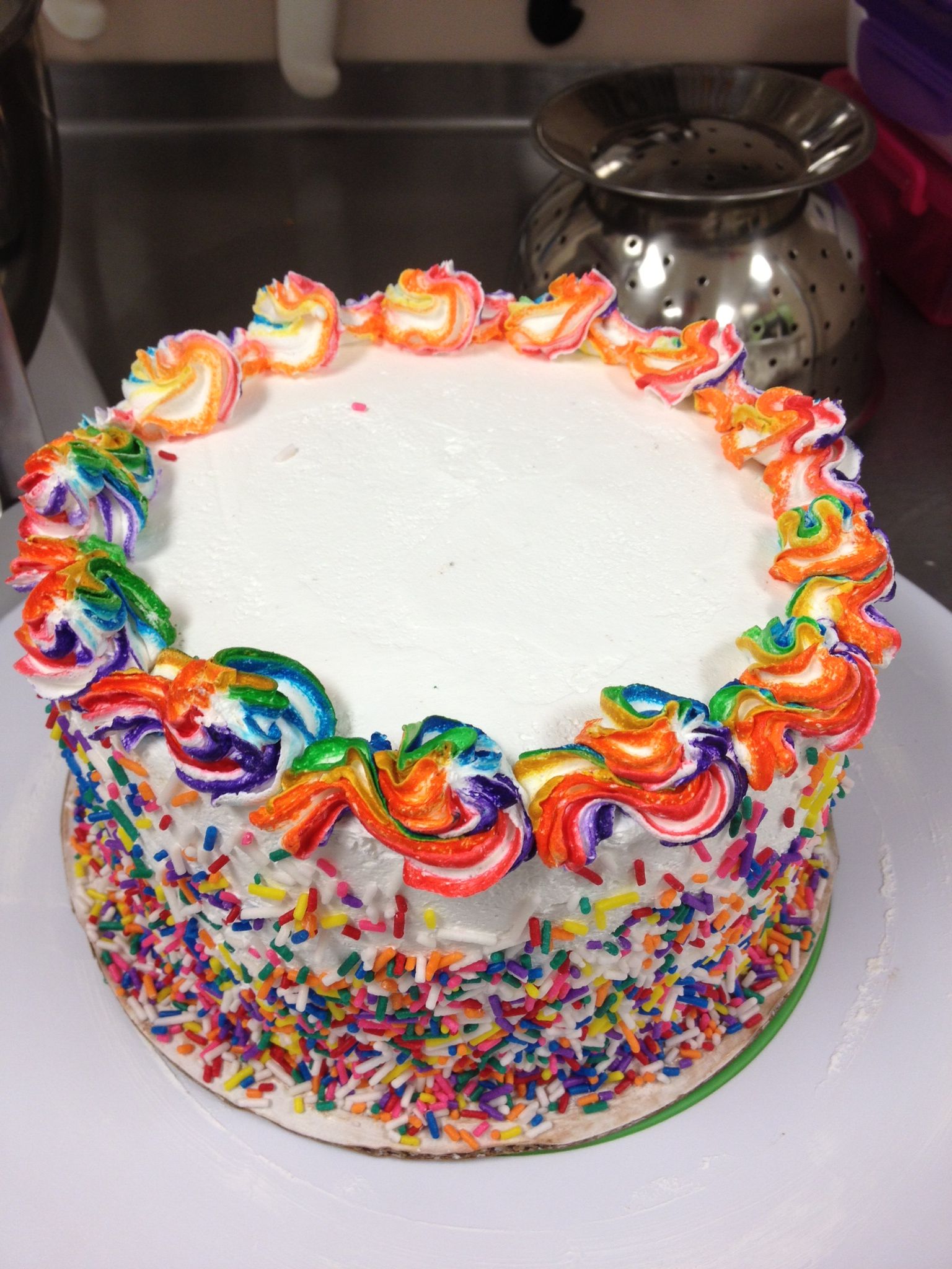 Rainbow colored ice cream cake